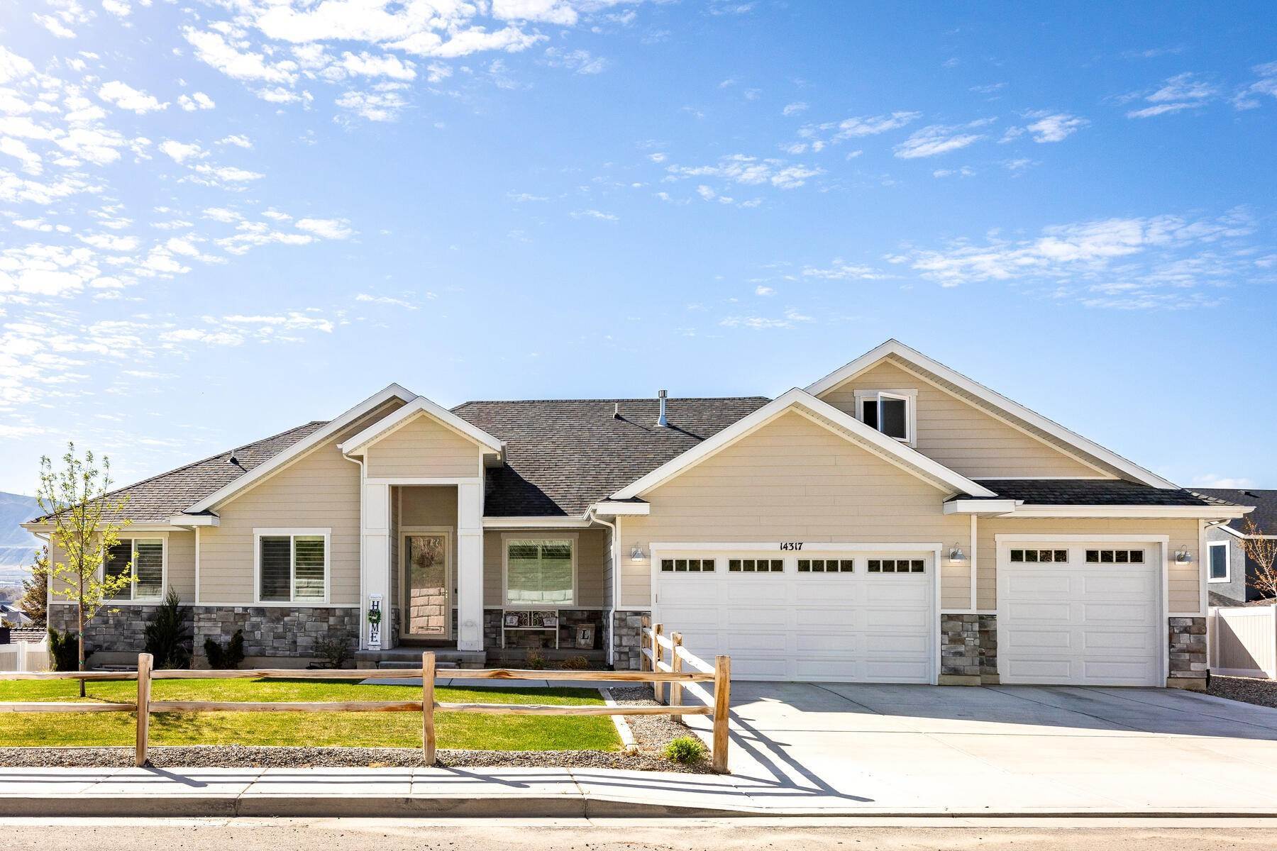 Single Family Homes for Sale at Beautiful Custom Rambler with Main Floor Living and Views of Wasatch Front 14317 S Loumis Pkwy Bluffdale, Utah 84065 United States